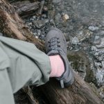 photo of a person wearing a gray shoe