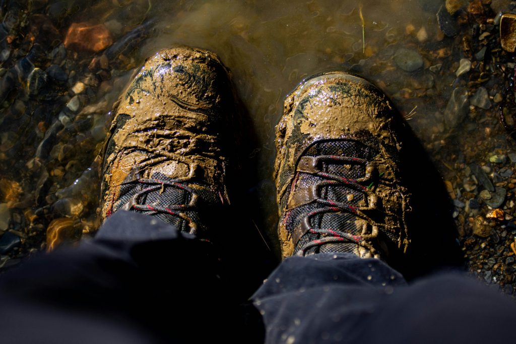 waterproof hiking boots on a muddy UK hiking trail