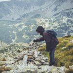 person standing on hill