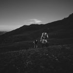 two men walking on the mountain