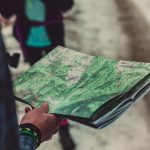 person holding outlined map