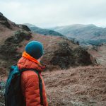 Hiker wearing a down jacket in cold UK countryside conditions